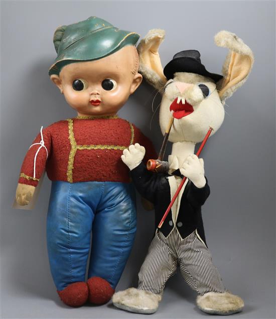 A comic felt rabbit, circa 1950s and a stuffed doll celluloid head, 1950s H.12in. & 15in.